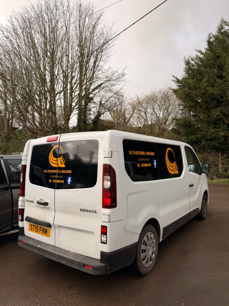 gloss black panel black out with gloss black orange sign writing on top for r.c plastering and building in our unit in Winterbourne, Bristol