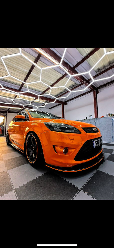 gloss orange vinyl pinstripe installed around the bottom of this focus, Winterbourne  