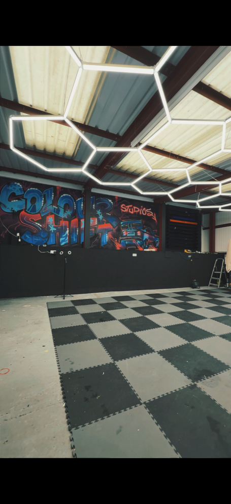 our wrap shop in Winterbourne featuring our custom painted wall and checkered floor 